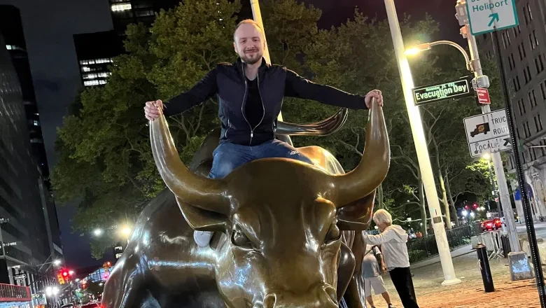 Felix-Antoine Vezina-Poirier sitting on the Charging Bull in NYC, featured in his BCA career testimonial.